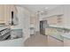 Kitchen with light wood cabinets, stainless steel appliances, and teal countertops at 3392 Pennyroyal Rd, Port Charlotte, FL 33953