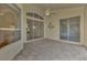 Bright lanai with tiled floor and sliding glass doors at 3392 Pennyroyal Rd, Port Charlotte, FL 33953