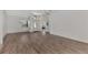 Open living room with tile flooring and views to the entryway at 3392 Pennyroyal Rd, Port Charlotte, FL 33953