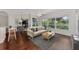 Spacious living room with hardwood floors and access to a screened patio at 3392 Pennyroyal Rd, Port Charlotte, FL 33953