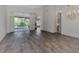 Large living area with sliding doors leading to the patio at 3392 Pennyroyal Rd, Port Charlotte, FL 33953