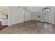 Living room with tile floors, views of kitchen and entryway at 3392 Pennyroyal Rd, Port Charlotte, FL 33953