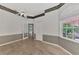 Bright office with multiple windows, wood-look tile floors and a door at 3392 Pennyroyal Rd, Port Charlotte, FL 33953