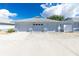 Three-car garage with a spacious driveway at 6546 Hamlet Dr # 17A, Englewood, FL 34224