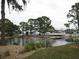 Serene waterfront view with bridge and lush foliage at 6800 Placida Rd # 179, Englewood, FL 34224
