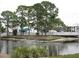 Community features a peaceful waterfront area with lush landscaping at 6800 Placida Rd # 179, Englewood, FL 34224