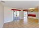 Bright dining area with tile floors and access to a sunroom at 7582 Lyncrest St, North Port, FL 34287