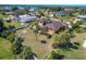 Aerial view showcasing the house, backyard, and surrounding neighborhood at 90 Green Dolphin N Dr, Placida, FL 33946