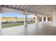 Covered patio with arched openings and views of the golf course and water at 10030 Eagle Preserve Dr, Englewood, FL 34224