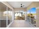 Screened balcony offering stunning golf course and water views at 10030 Eagle Preserve Dr, Englewood, FL 34224