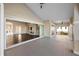 Large balcony with sliding doors that open to a living area with a fireplace at 10030 Eagle Preserve Dr, Englewood, FL 34224
