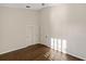 Bright bedroom with hardwood floors and double doors at 10030 Eagle Preserve Dr, Englewood, FL 34224
