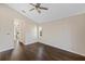 Spacious bedroom with hardwood floors and large window at 10030 Eagle Preserve Dr, Englewood, FL 34224