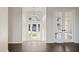 Bright and airy entryway with double doors and hardwood floors at 10030 Eagle Preserve Dr, Englewood, FL 34224