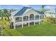 Elevated home with screened porch overlooking the water at 10030 Eagle Preserve Dr, Englewood, FL 34224