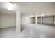 Spacious two-car garage with epoxy flooring and ample storage at 10030 Eagle Preserve Dr, Englewood, FL 34224