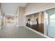 View of kitchen from the balcony. Features modern white cabinets and stainless steel appliances at 10030 Eagle Preserve Dr, Englewood, FL 34224