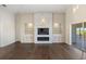 Living room features a modern fireplace and built-in shelving at 10030 Eagle Preserve Dr, Englewood, FL 34224