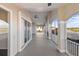 Long screened balcony offering scenic water views at 10030 Eagle Preserve Dr, Englewood, FL 34224
