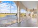 Spacious screened balcony with golf course and lake views at 10030 Eagle Preserve Dr, Englewood, FL 34224