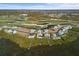 Several waterfront homes along the coastline with docks, pools, and lush greenery at 10030 Eagle Preserve Dr, Englewood, FL 34224