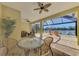 Spacious patio overlooking a lake with seating at 10809 O Meara Way, Englewood, FL 34223