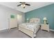 Spacious bedroom with a calm color scheme, carpeted floor and walk-in closet at 11249 Mc Dermott Ct, Englewood, FL 34223