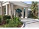 Elegant clubhouse entrance with columns and a covered awning at 11249 Mc Dermott Ct, Englewood, FL 34223