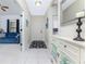 Bright and airy entryway with tiled floor and console table at 11249 Mc Dermott Ct, Englewood, FL 34223