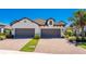 Two-car garage and paver driveway at 11249 Mc Dermott Ct, Englewood, FL 34223