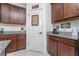 Well-equipped kitchen with ample cabinetry and granite countertops at 11249 Mc Dermott Ct, Englewood, FL 34223