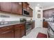 Stainless steel appliances and granite countertops at 11249 Mc Dermott Ct, Englewood, FL 34223