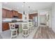 Open concept kitchen with island and stainless steel appliances at 11249 Mc Dermott Ct, Englewood, FL 34223