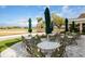 Enjoy resort-style living on this outdoor patio with tables and chairs at 11249 Mc Dermott Ct, Englewood, FL 34223