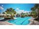 Community pool with lap lanes, a spa, and plenty of lounge chairs at 11249 Mc Dermott Ct, Englewood, FL 34223