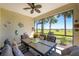 Spacious screened porch, complete with dining set and tranquil views at 11249 Mc Dermott Ct, Englewood, FL 34223