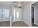 Bright entryway with tile floors, white door, and gray walls at 1131 Boundary Blvd, Rotonda West, FL 33947