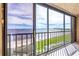 Stunning waterfront view from the balcony with sliding glass doors at 14459 River Beach Dr # 118, Port Charlotte, FL 33953