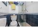 Bathroom with shower and decorative tile at 1551 Beach Rd # 207, Englewood, FL 34223