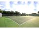 Two well-maintained tennis courts with surrounding fencing at 16 Golfview Ct, Rotonda West, FL 33947