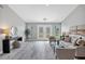 Bright and airy living room featuring a stylish and comfortable sitting area at 19 Long Meadow Ln, Rotonda West, FL 33947