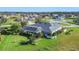 Aerial view highlighting the home's backyard oasis and neighborhood setting at 2 Broadmoor Rd, Rotonda West, FL 33947