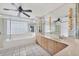 Primary bathroom with double vanity, large soaking tub, and glass shower at 2 Broadmoor Rd, Rotonda West, FL 33947