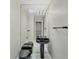 Modern bathroom with black vanity and large mirror at 2 Broadmoor Rd, Rotonda West, FL 33947