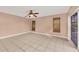 Bedroom with tile flooring and sliding glass doors to a patio at 2 Broadmoor Rd, Rotonda West, FL 33947