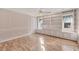 Bright bedroom with built-in shelving and hardwood floors at 2 Broadmoor Rd, Rotonda West, FL 33947