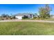 Single-story home with attached garage and well-maintained landscaping at 2 Broadmoor Rd, Rotonda West, FL 33947