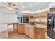 Large kitchen with an island, granite countertops, and stainless steel appliances at 2 Broadmoor Rd, Rotonda West, FL 33947
