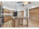 Kitchen boasts granite island, wood cabinets, and stainless steel appliances at 2 Broadmoor Rd, Rotonda West, FL 33947