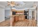 Open kitchen with granite countertops and wood cabinets at 2 Broadmoor Rd, Rotonda West, FL 33947